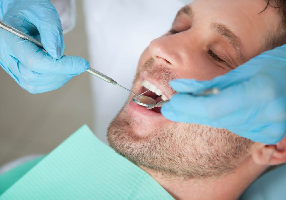 Female dentist with male patient
